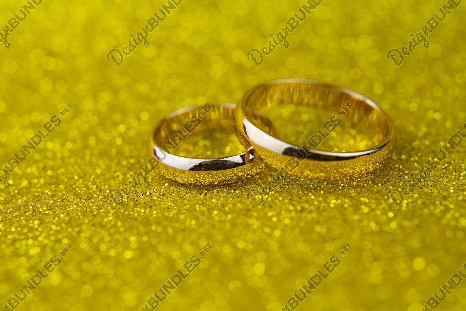 Download Gold Wedding Rings For Newlyweds On A Background With Bokeh 602465 Arts And Entertainment Design Bundles