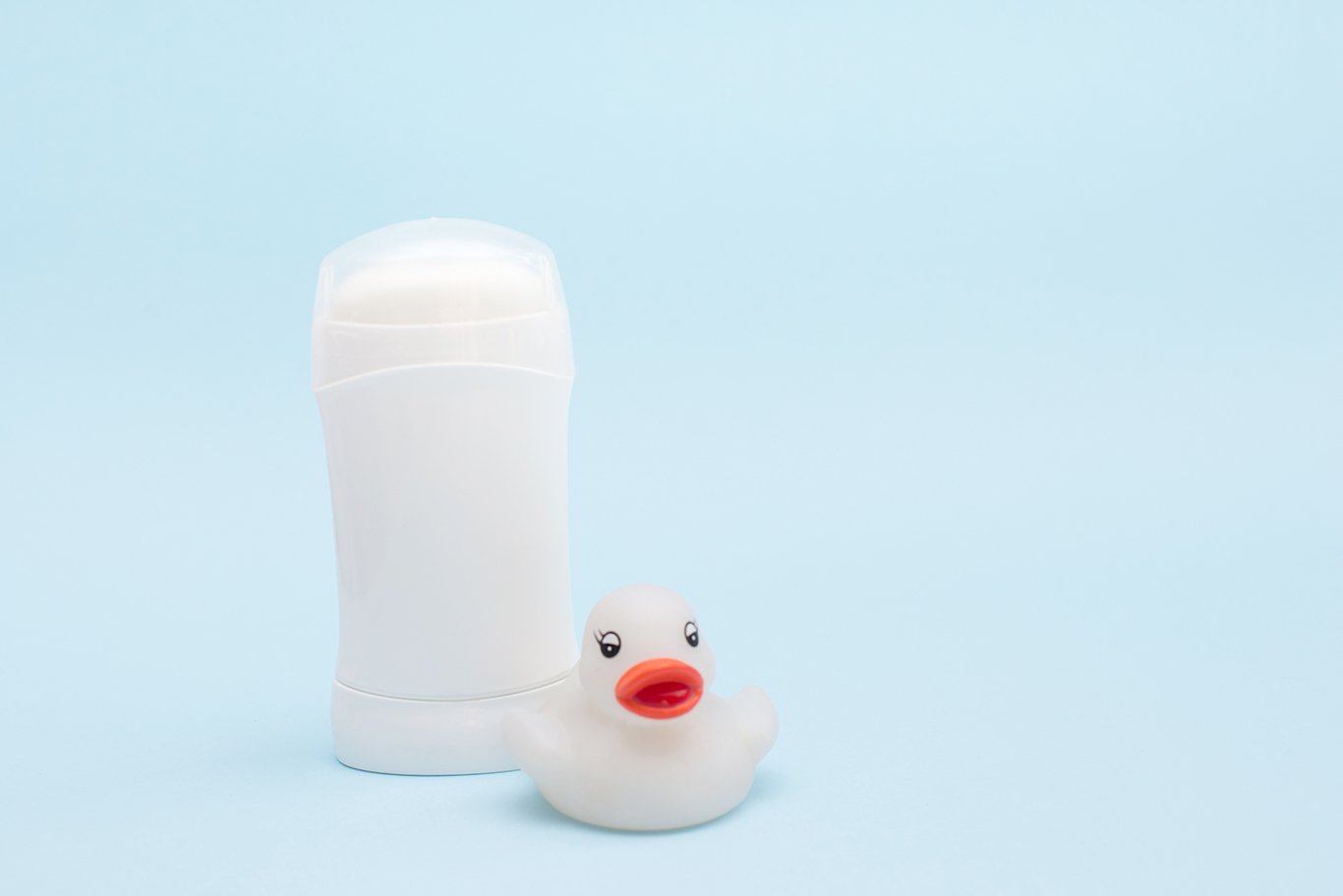 white deodorant or antiperspirant for child and toy duck (605283
