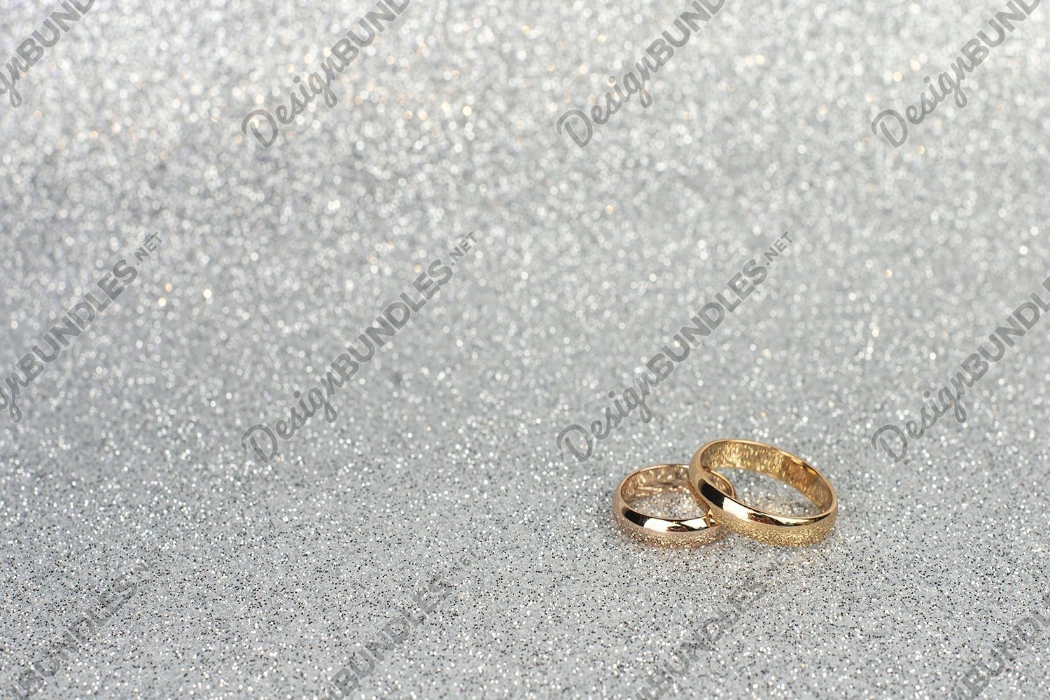Download Gold Wedding Rings For Newlyweds On A Silver Background 602312 Fashion Design Bundles