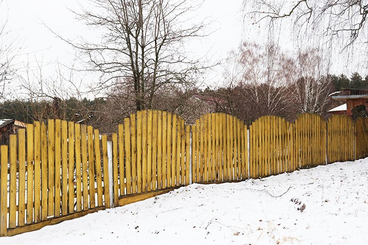 yellow wooden fence in the village (714501) General Design Bundles