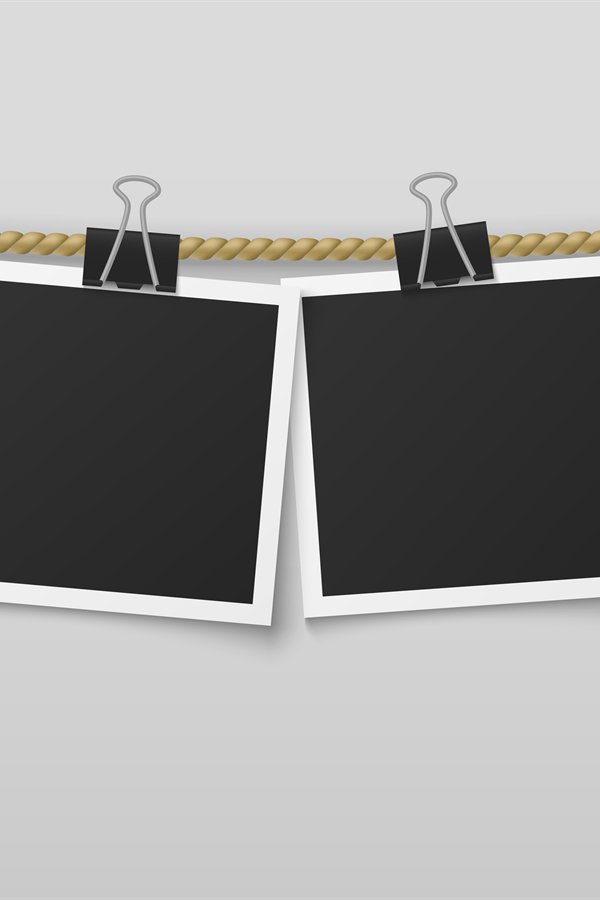Photo frame hanging on rope. Blank photo paper frames, retro