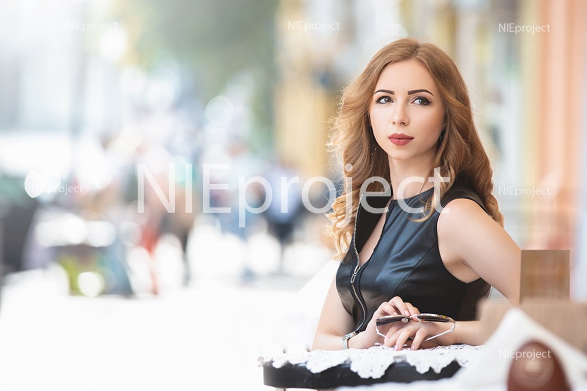 Attractive young Caucasian woman having a rest in cafe example image 1