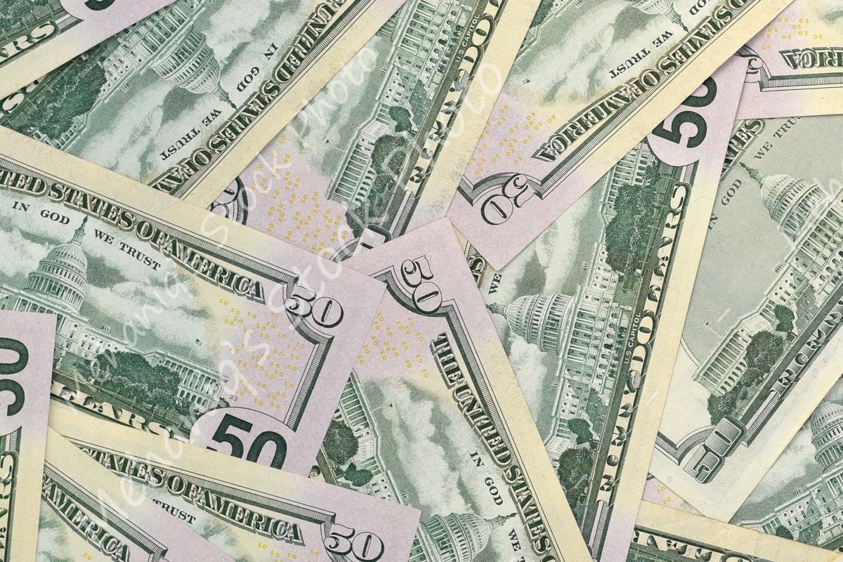 Many american dollar bills close up example image 1