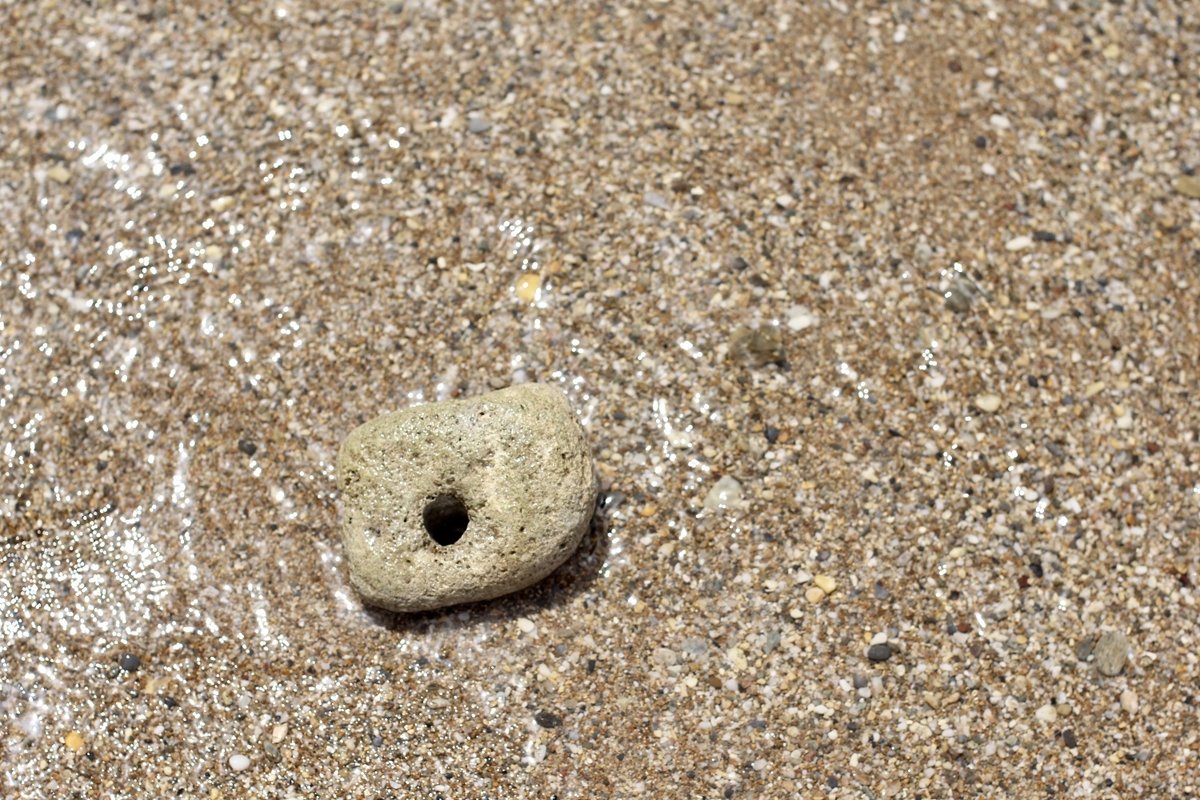 A large stone with a through hole example image 1