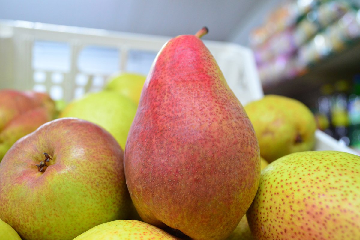 shelf with pears in a store close-up example image 1