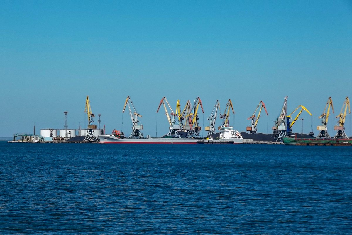 Harbor cranes by the sea example image 1