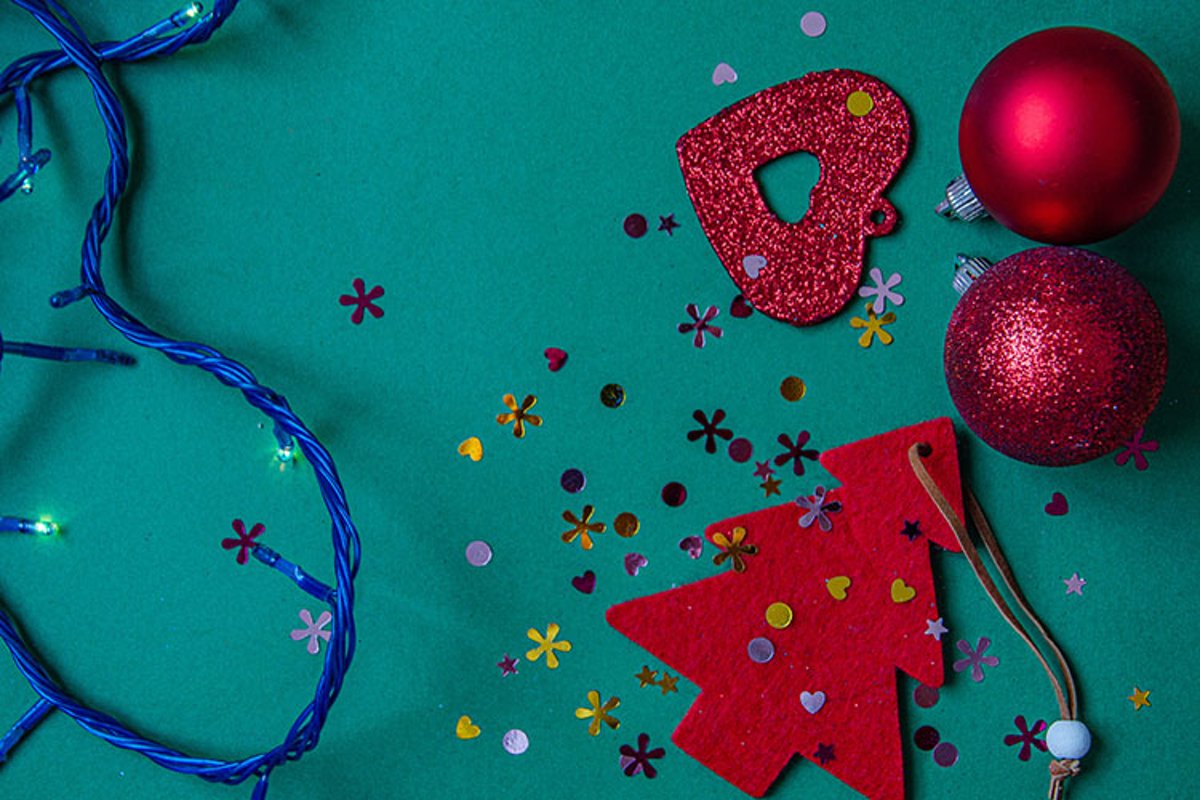 Red Christmas tree, beads, balls on a green background. example image 1