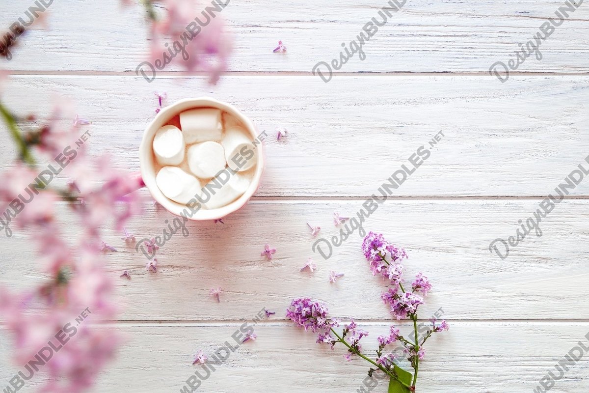 Photo of lilac and cups with sweets on a light background example image 1