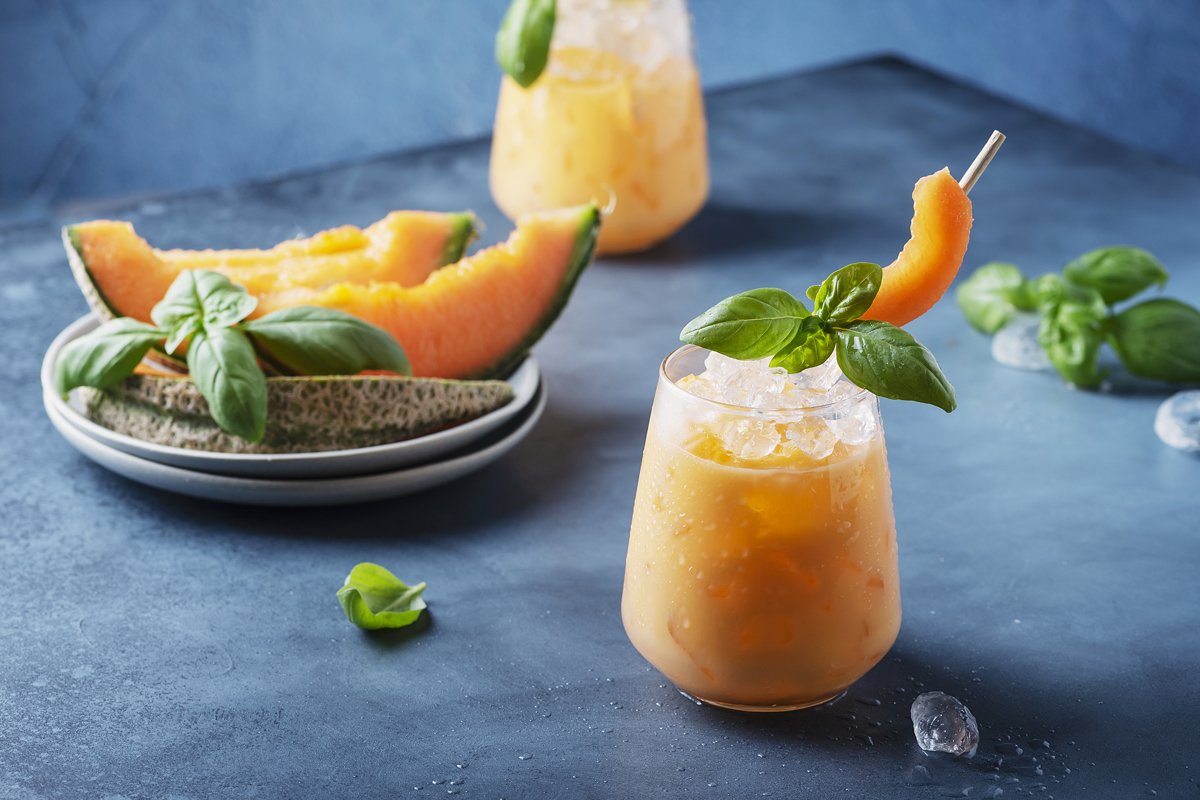 Bar concept. Sweet summer liquor with melon, ice and basil example image 1