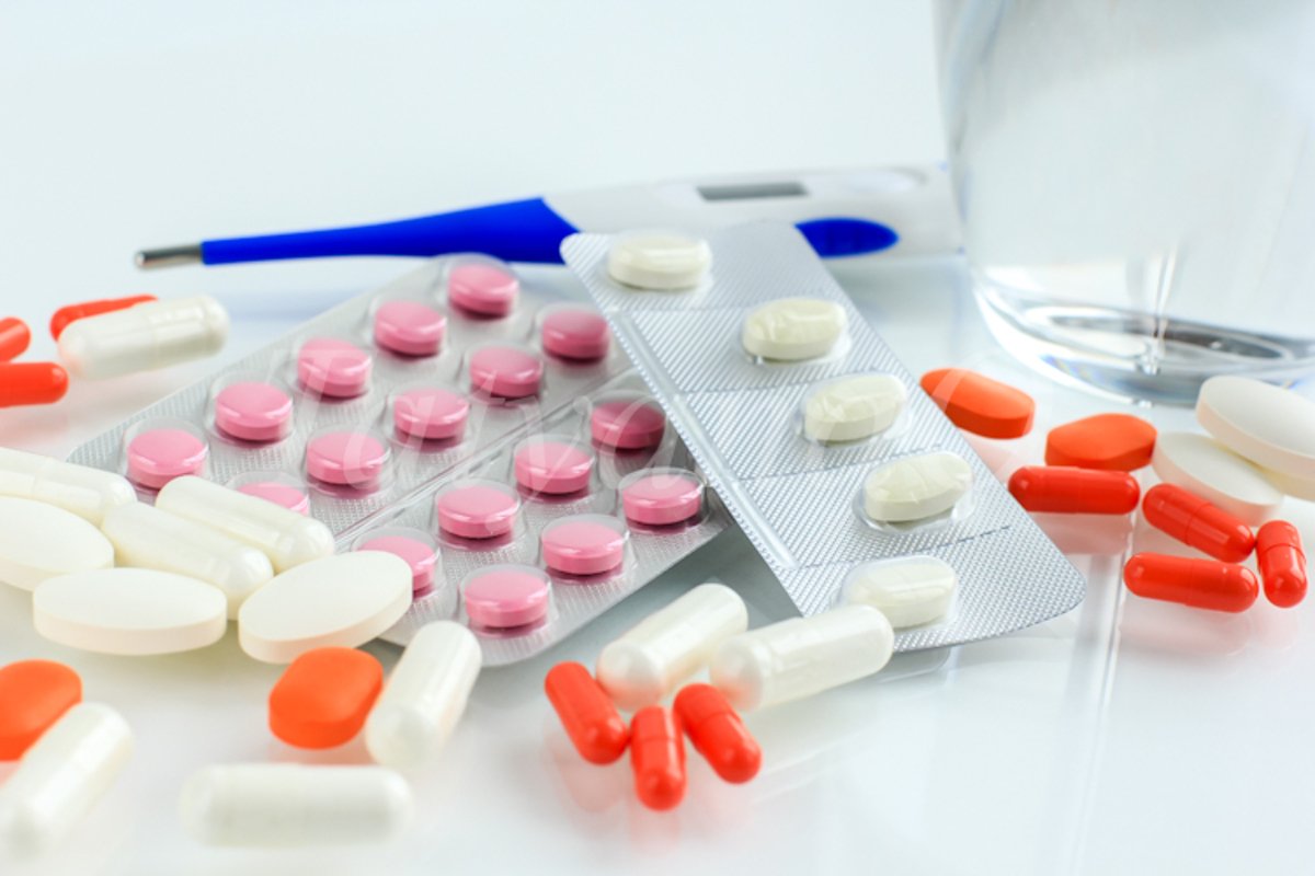 Multicolored pills, tablets against the virus, flu, disease example image 1