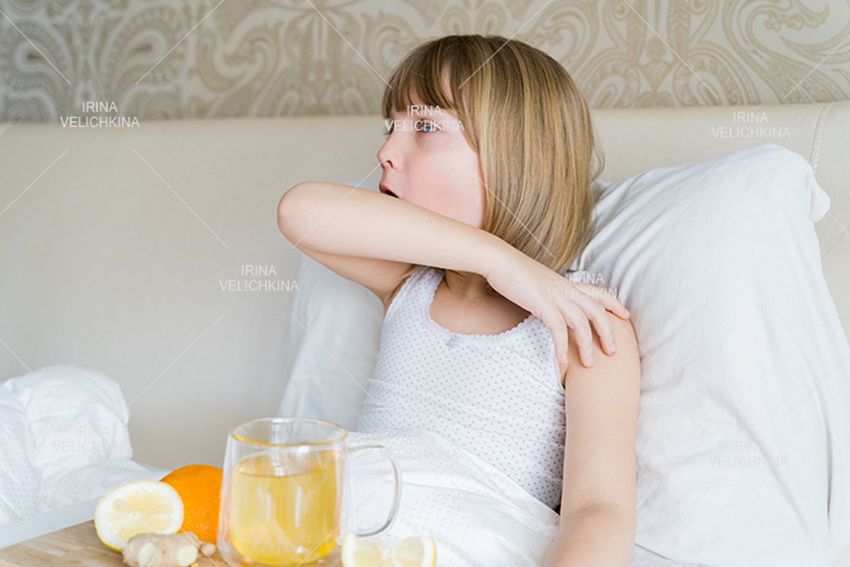 Sick girl in bed. Cup of flu drugs. Tea, orange,lemon,ginger example image 1