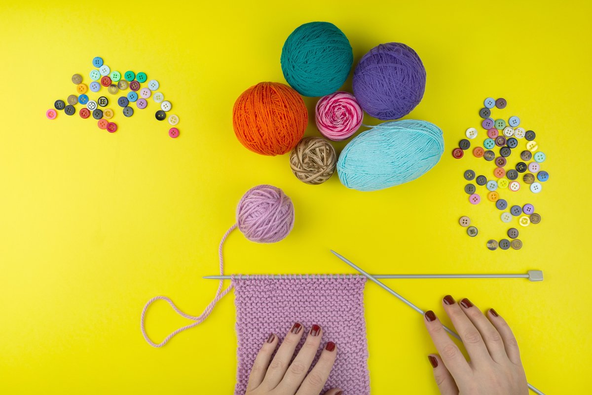 the girl knits a children's scarf on a yellow background example image 1