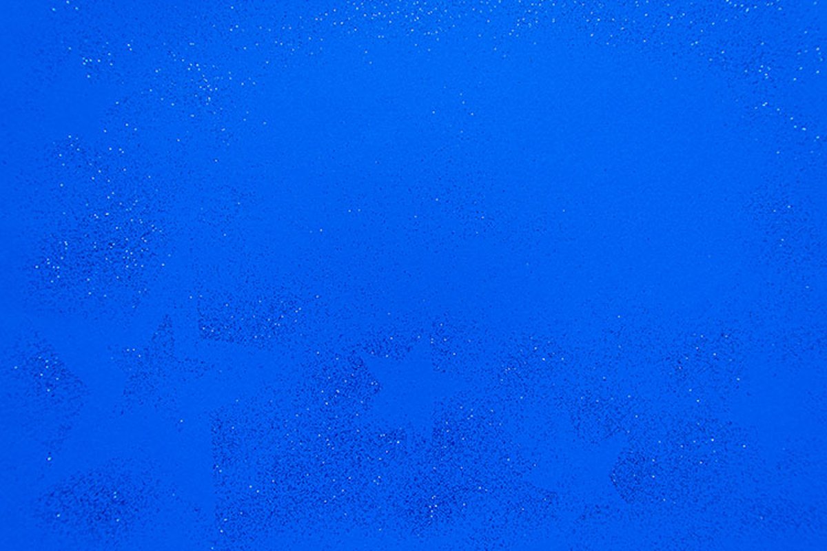 Silver sparkling christmas decoration on blue background. example image 1