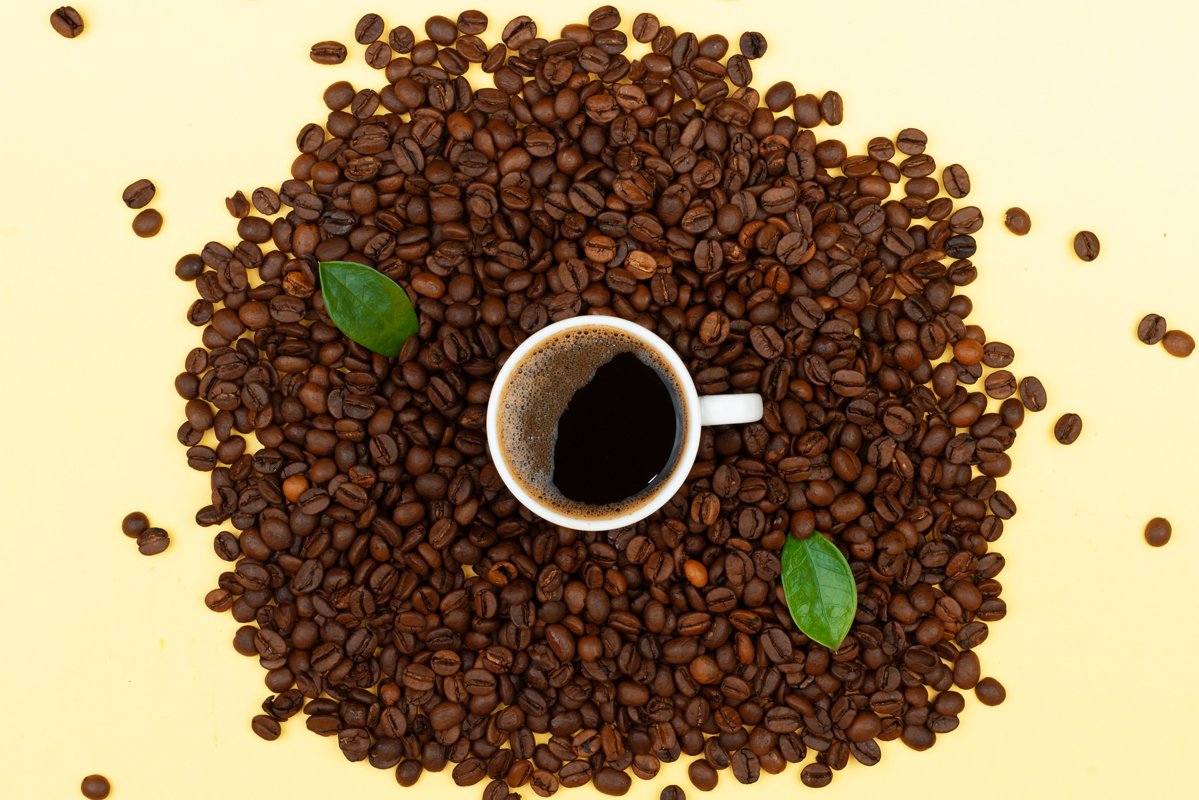 Fresh coffee and coffee beans on the table example image 1