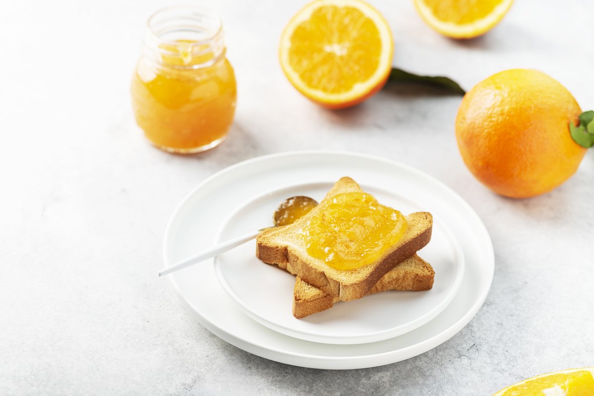 Traditional italian breakfast with Toast bread and oranges example image 1