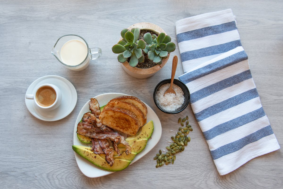 Fried bacon on white plate with cup of coffee and milk jug example image 1