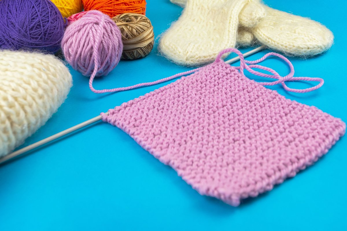 knitting set on blue background. example image 1