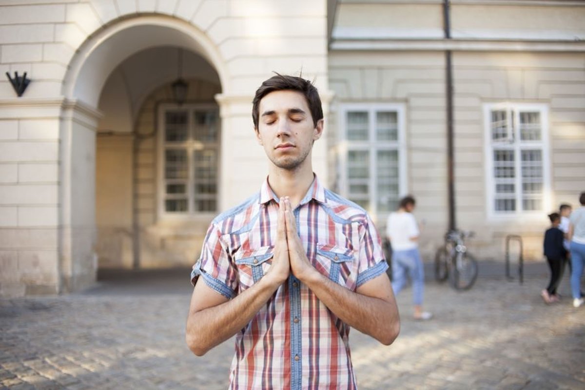 Young man walks in the city example image 1