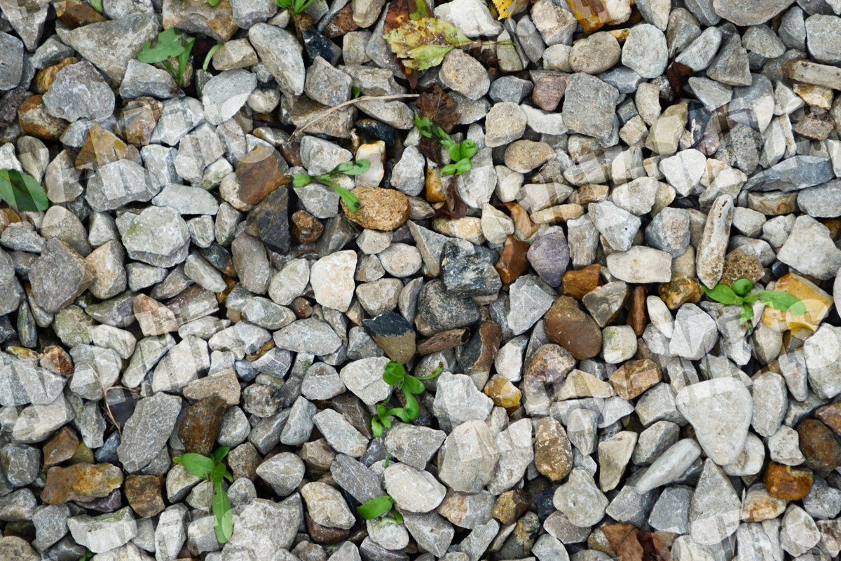 Gray and brown stones with blades of grass texture macro example image 1