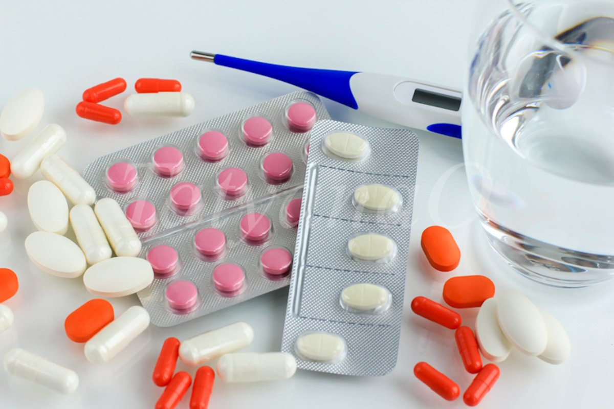 Multicolored pills, tablets against the virus, flu, disease example image 1