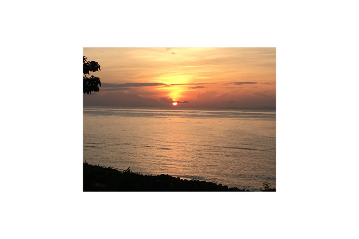 Photo of the sunset in the coastal town of Bacong example image 1