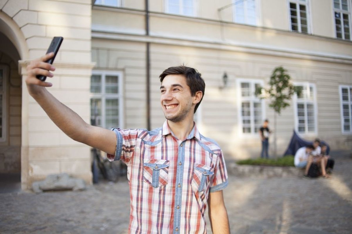 Young man walks in the city example image 1