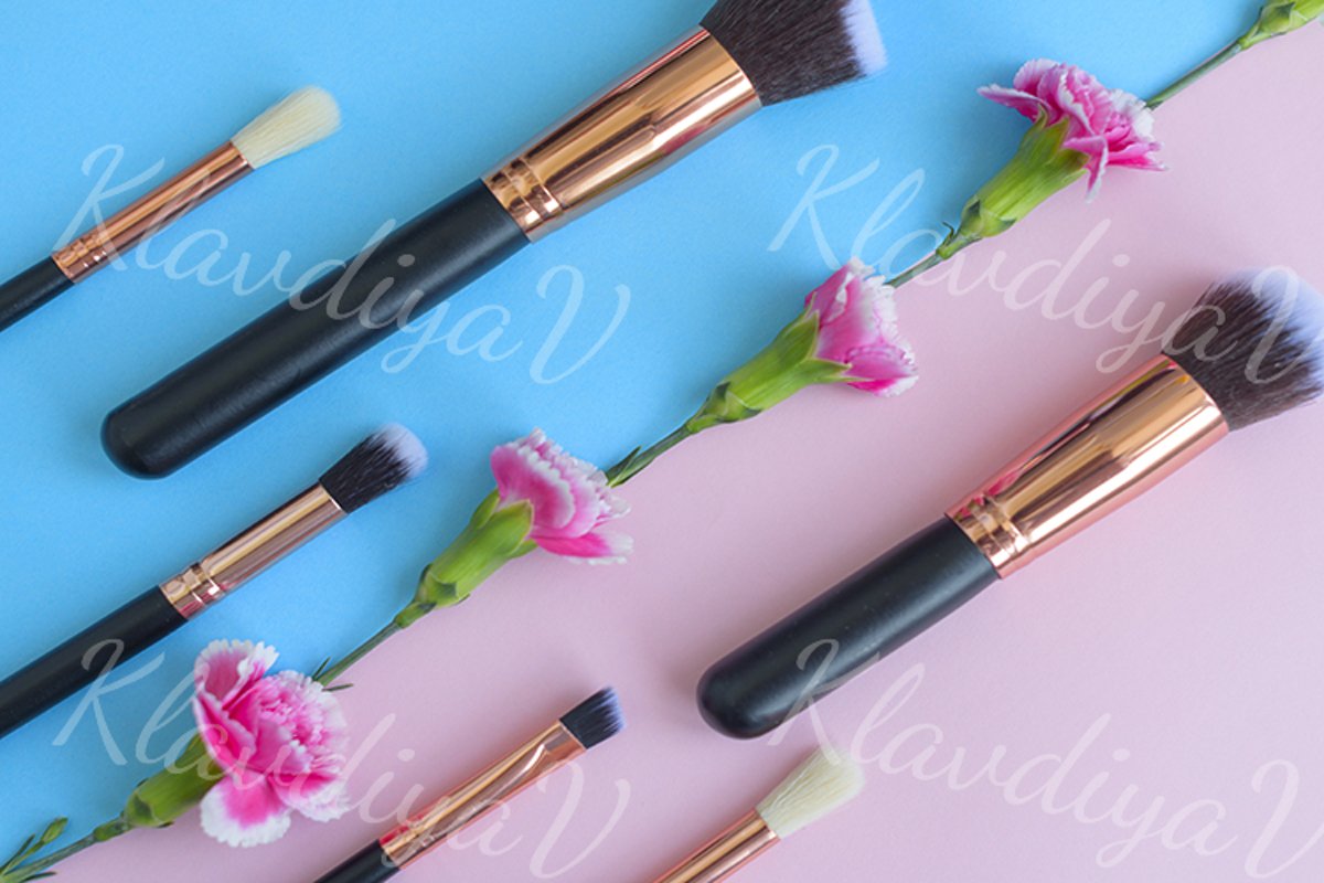 premium makeup brushes and blush on a colored background example image 1