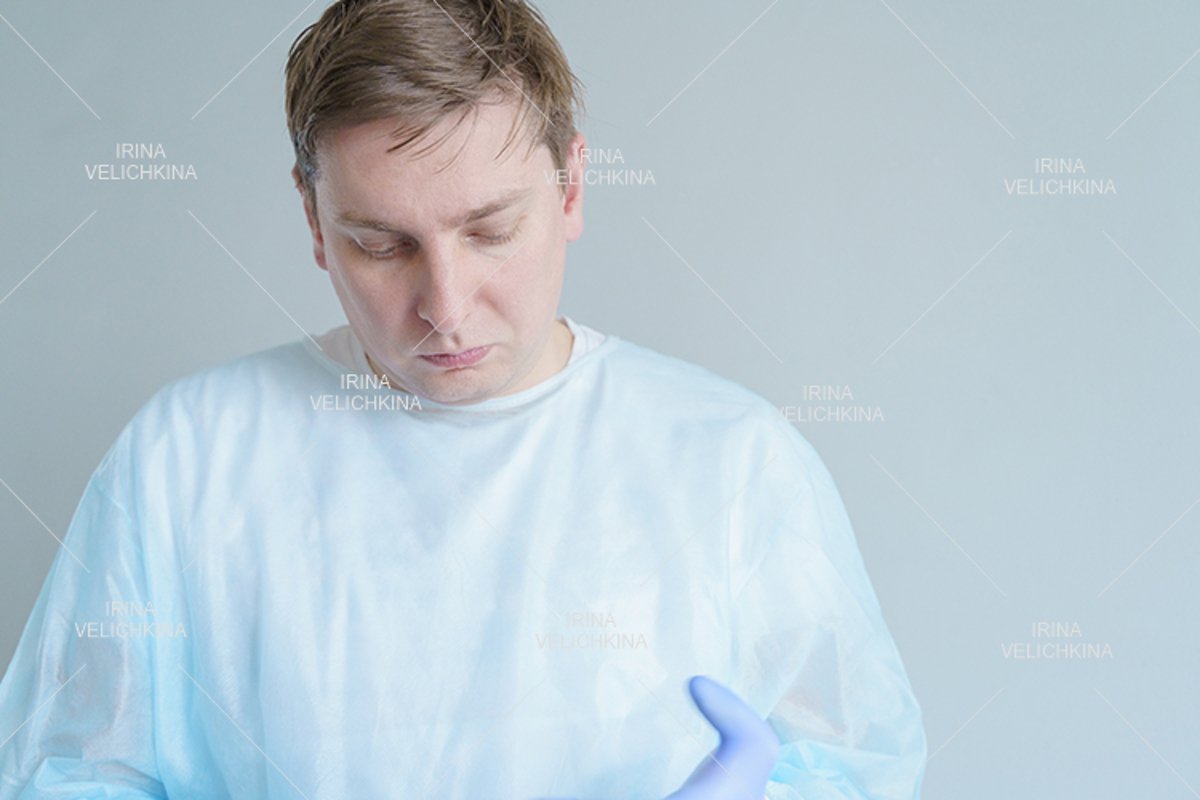 Doctor, patient in medical disposable hat, robe, blue gloves example image 1
