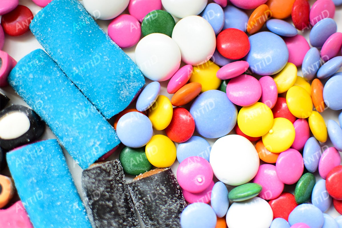Multicolored candy on a white background. example image 1