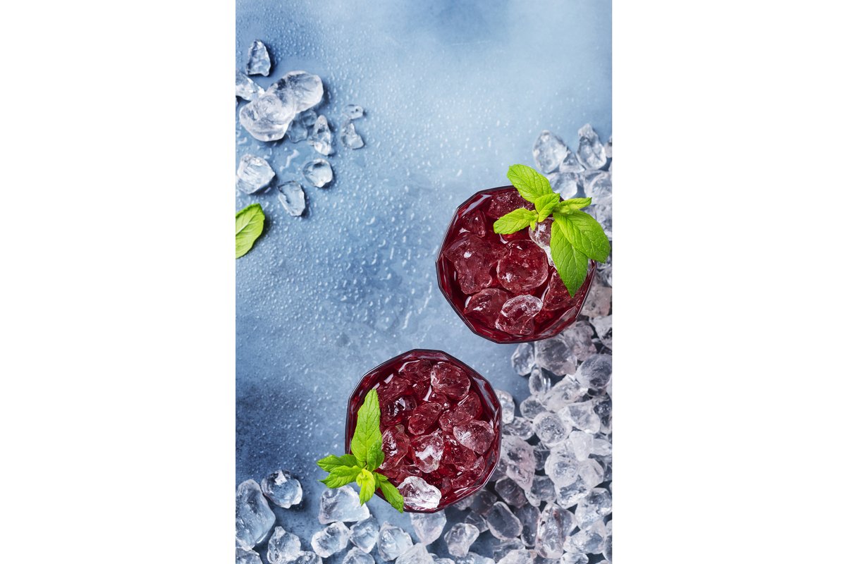 Top view image of a red cocktail with ice and mint example image 1
