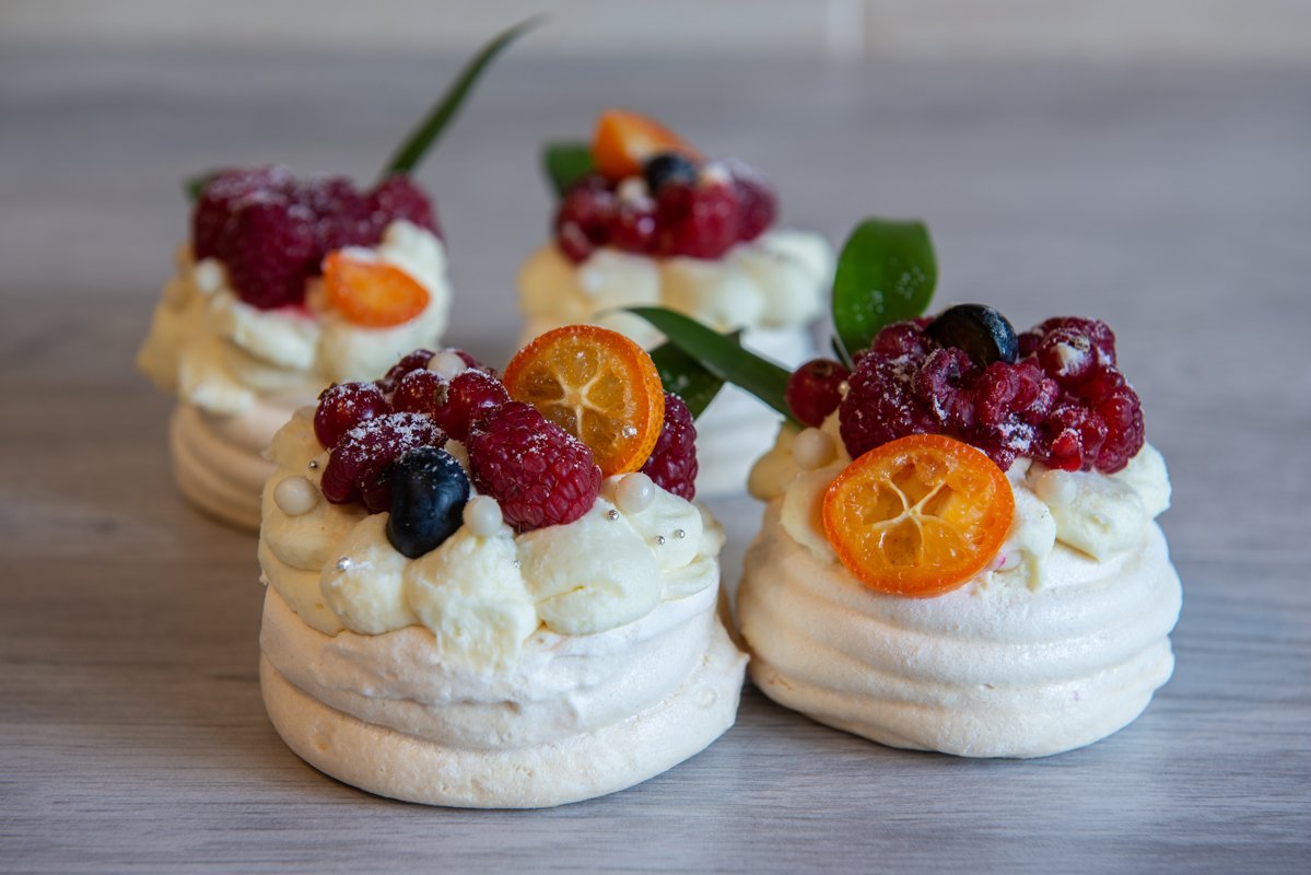 Pavlova meringue cake with cream and small fruits example image 1