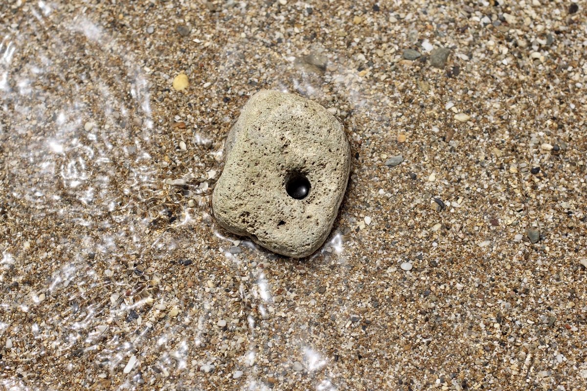 A large stone with a through hole example image 1