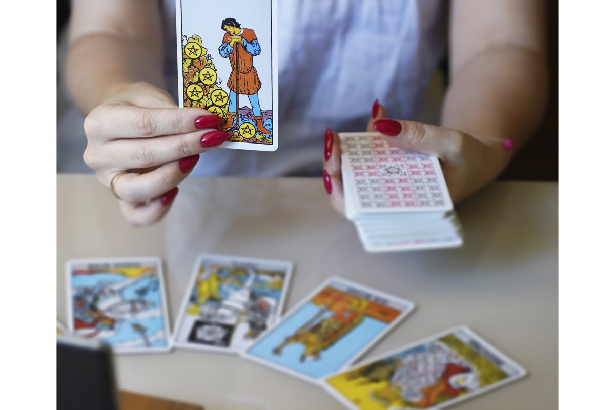 Tarot reader picking tarot cards. example image 1