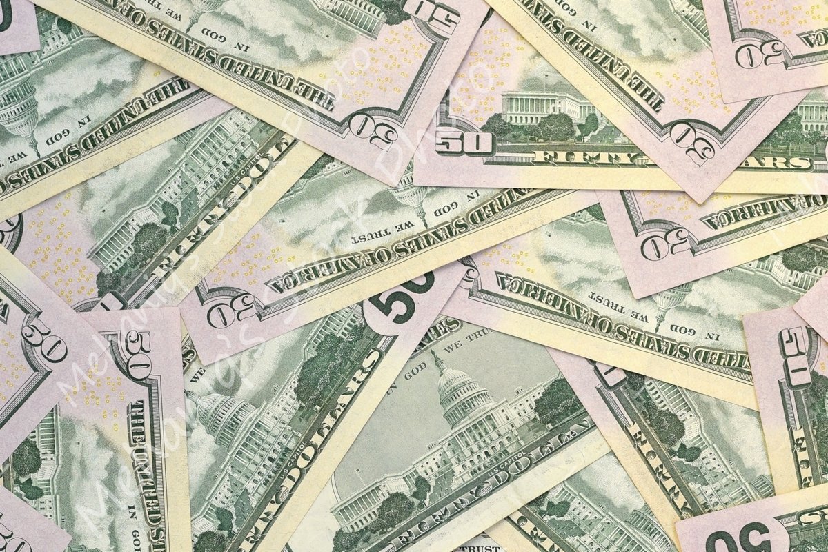 Many american dollar bills close up example image 1