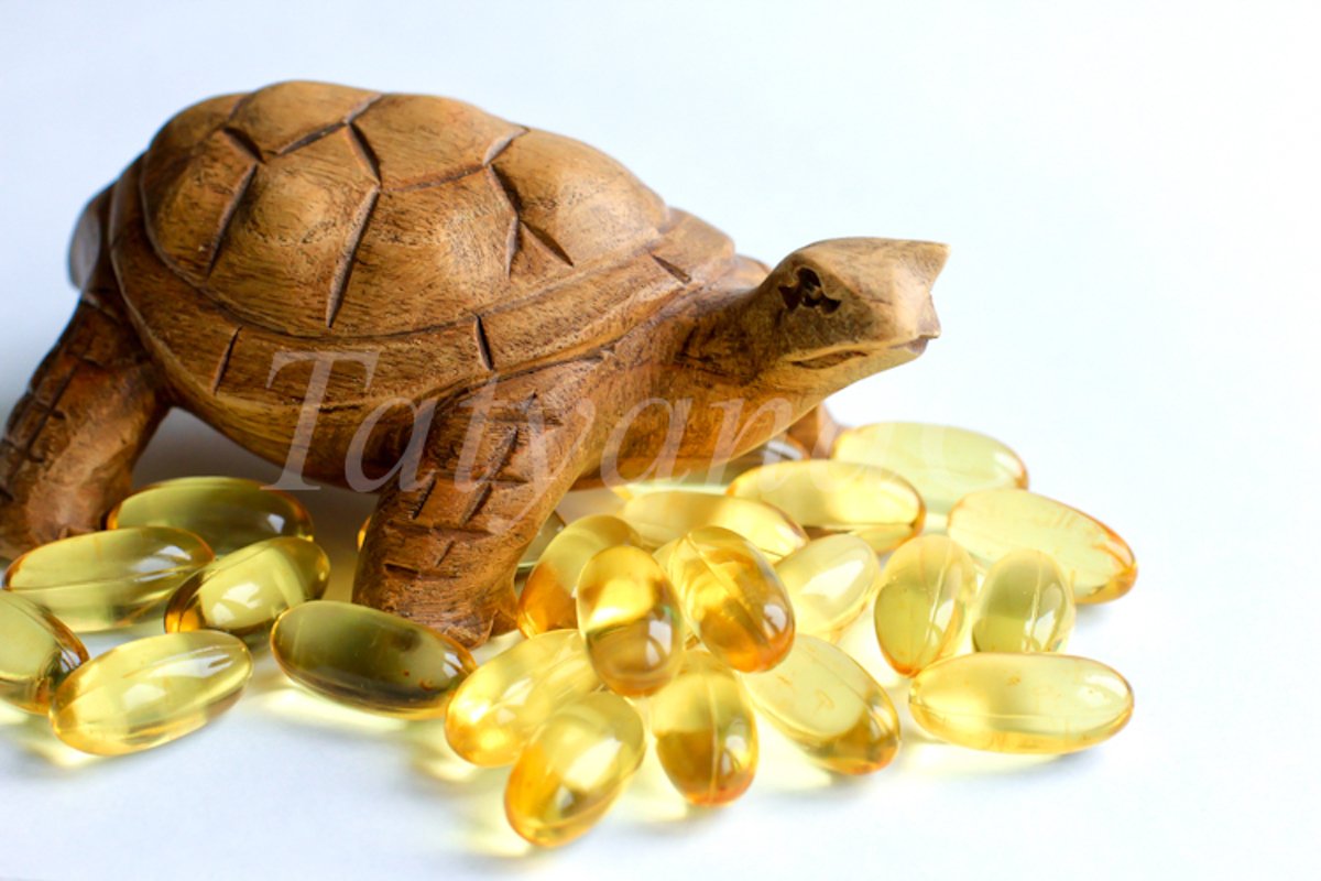 Omega 3 capsules lying on white background example image 1