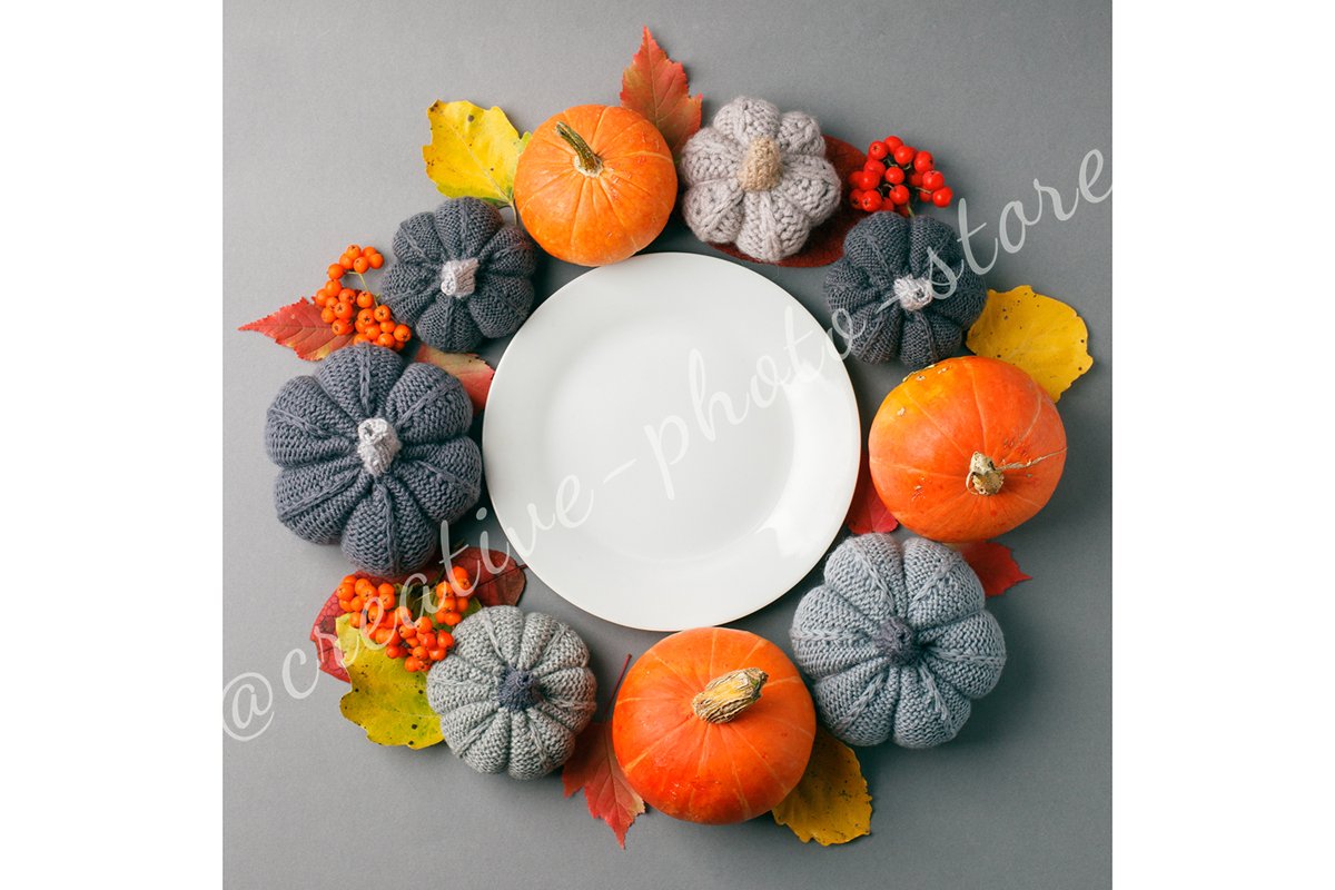 White plate with autumnal decor on gray background example image 1
