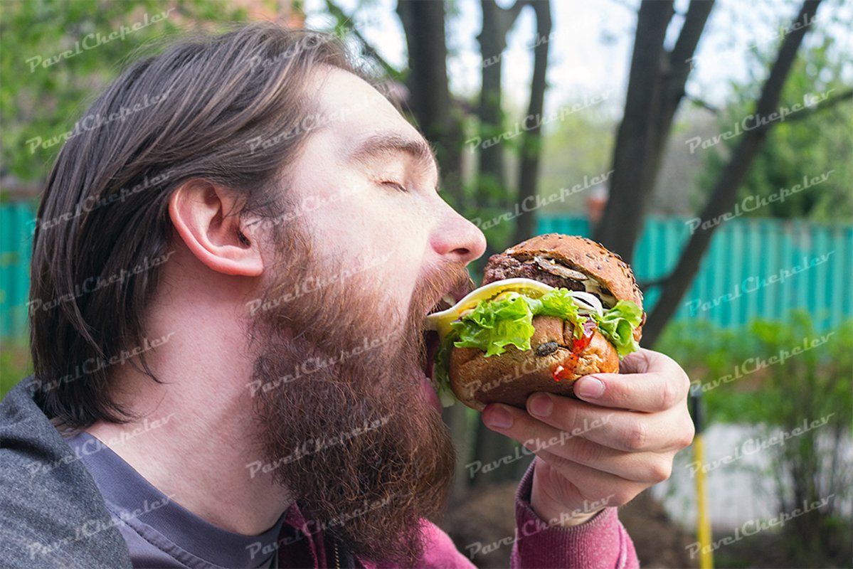 Bearded man eat burger example image 1