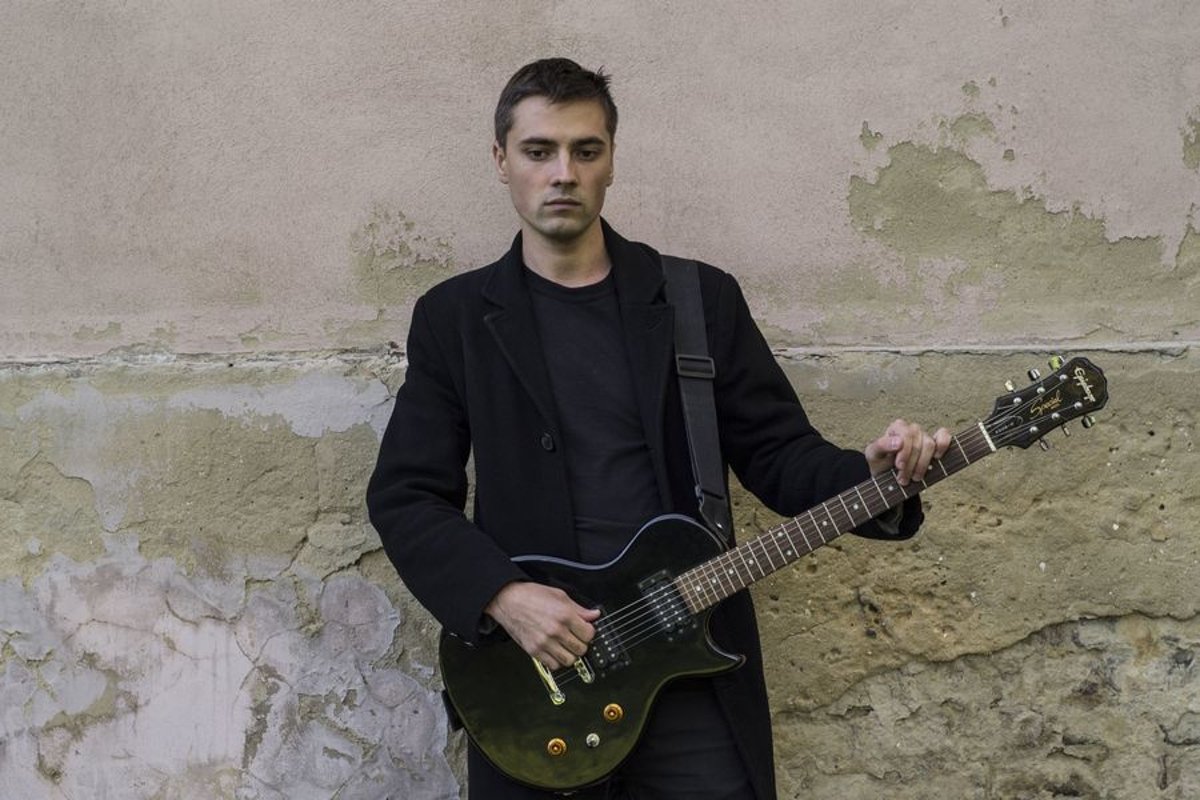Young caucasian man with electric guitar example image 1