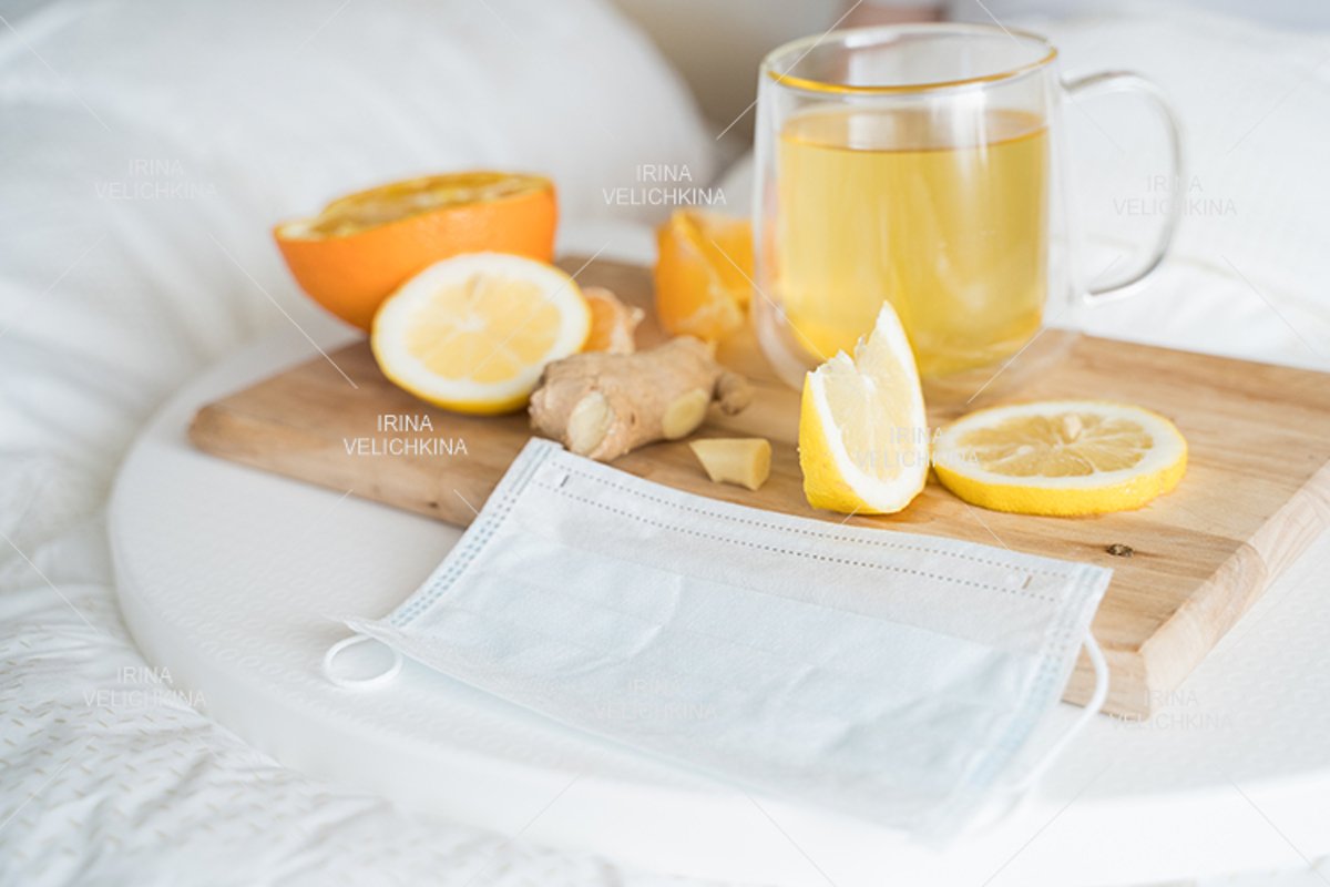 Cup of tea, orange,lemon,ginger. Face mask. Sick man in bed example image 1