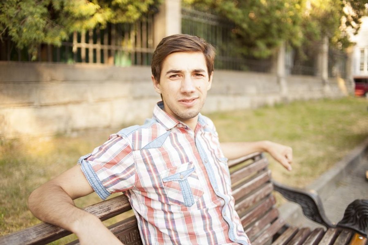 Young man walks in the city example image 1