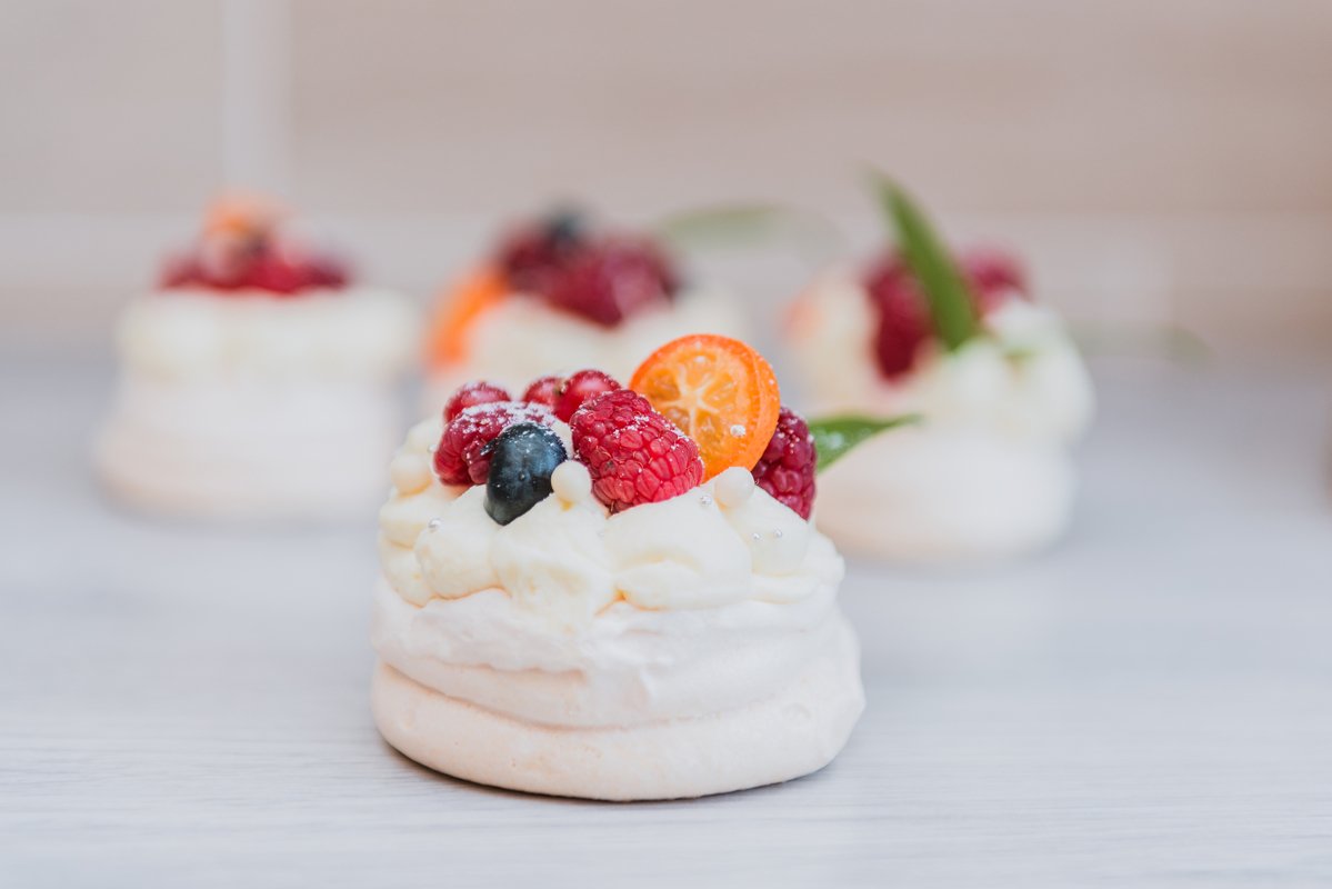 Pavlova meringue cake with cream and small fruits example image 1