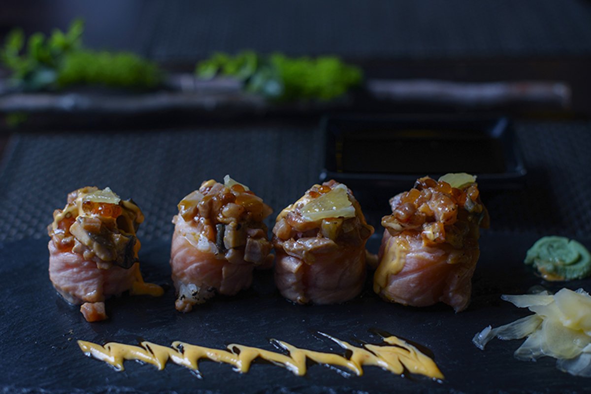 seared salmon and eel sushi rolls on dark background example image 1