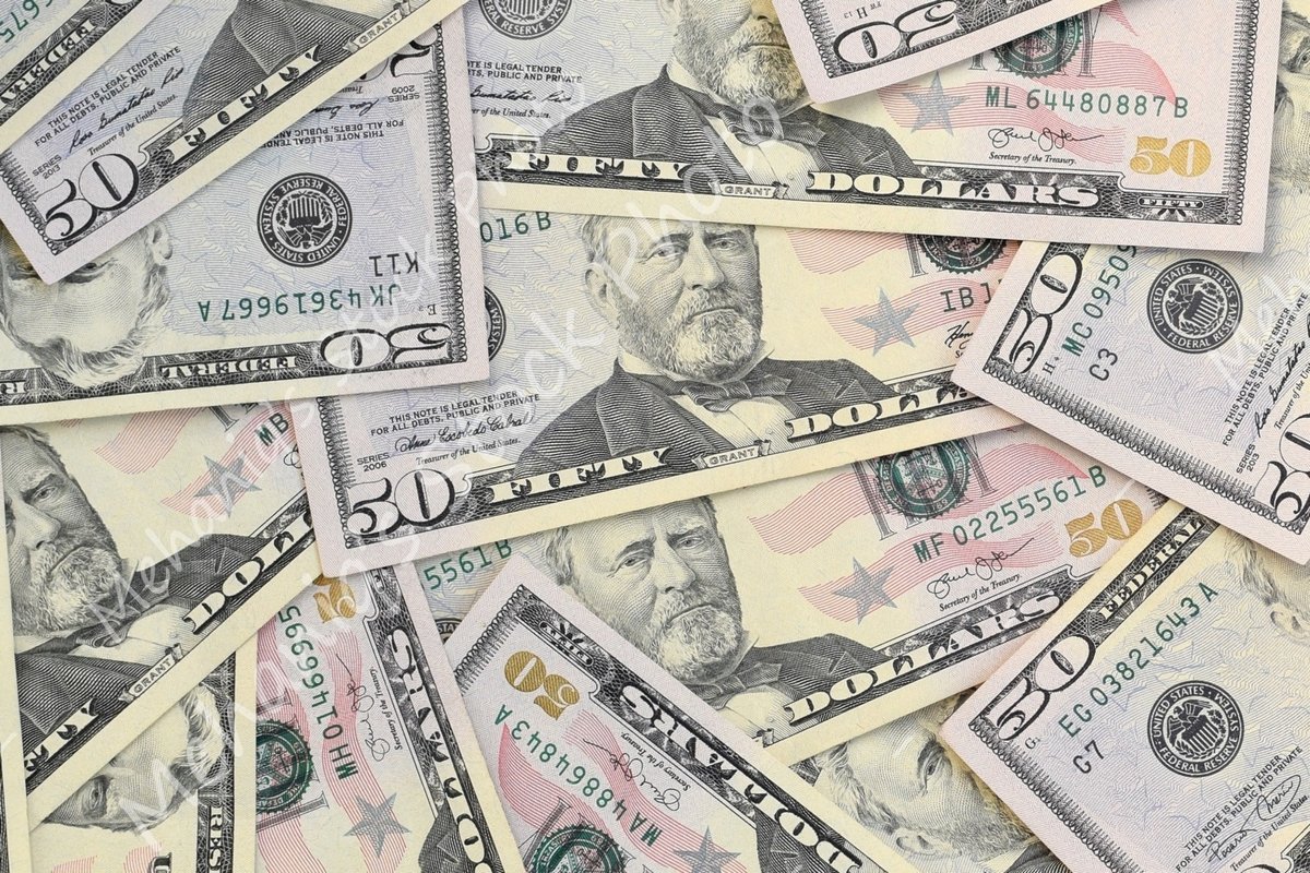 Many american dollar bills close up example image 1