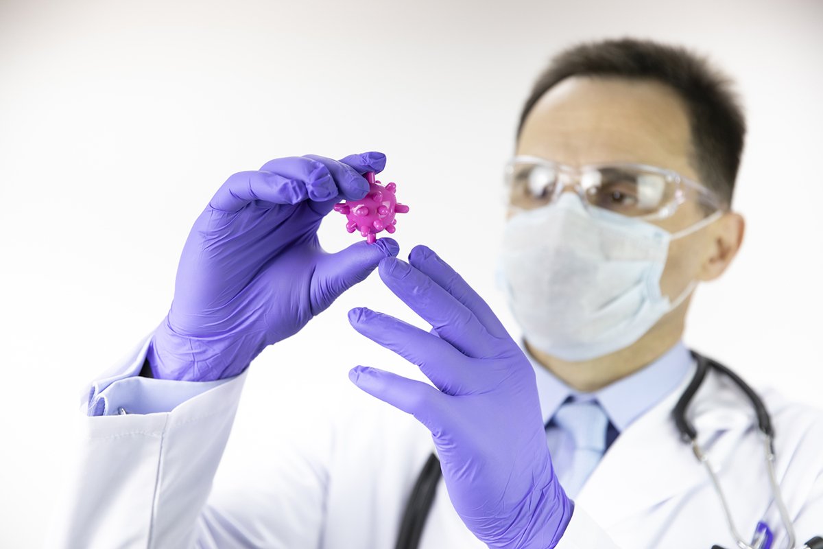 Doctor therapist with a stethoscope on a red background example image 1