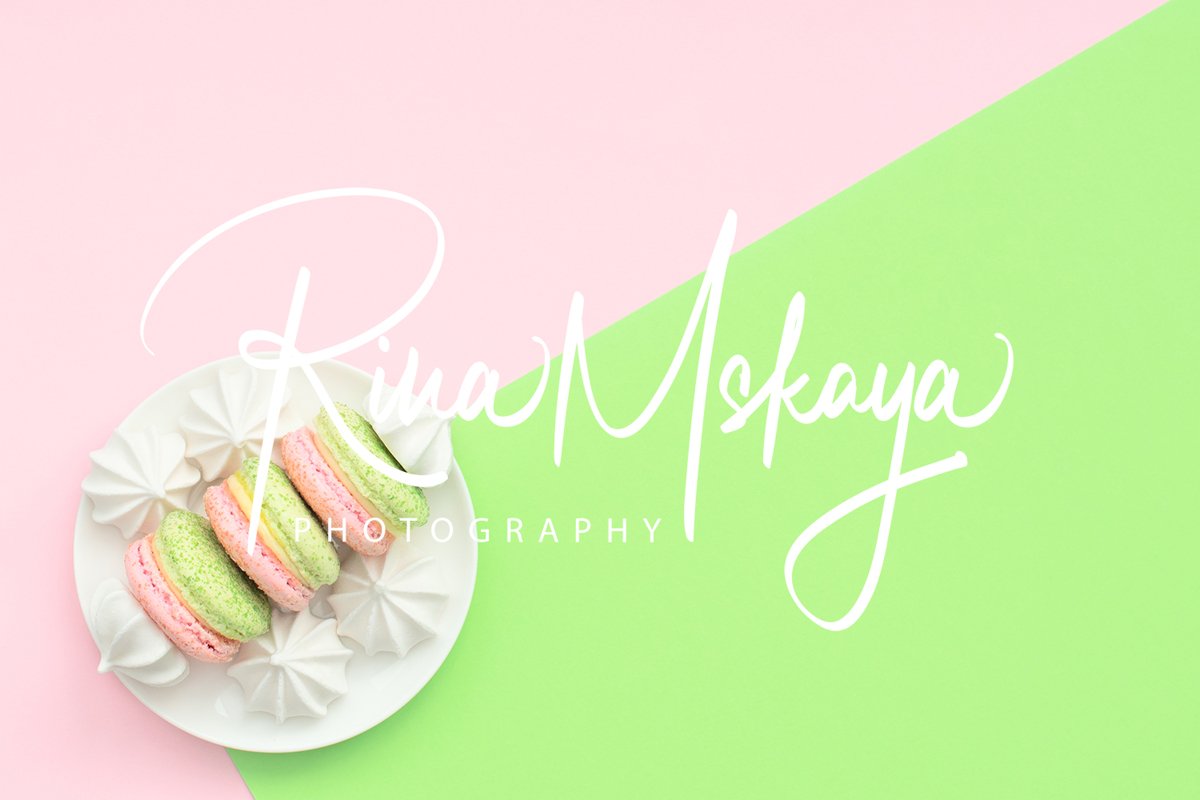 Delicious macarons with white merengues on white plate example image 1