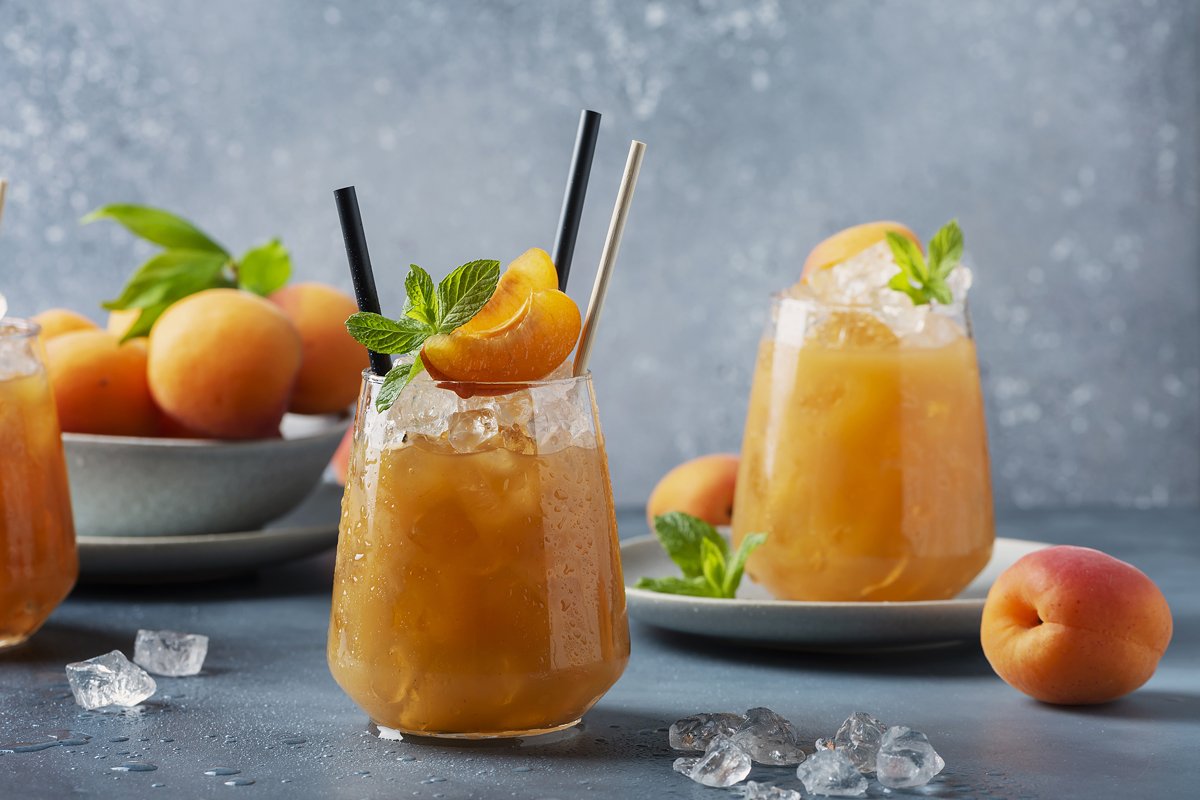 Fresh apricot cocktail with ice and mint example image 1