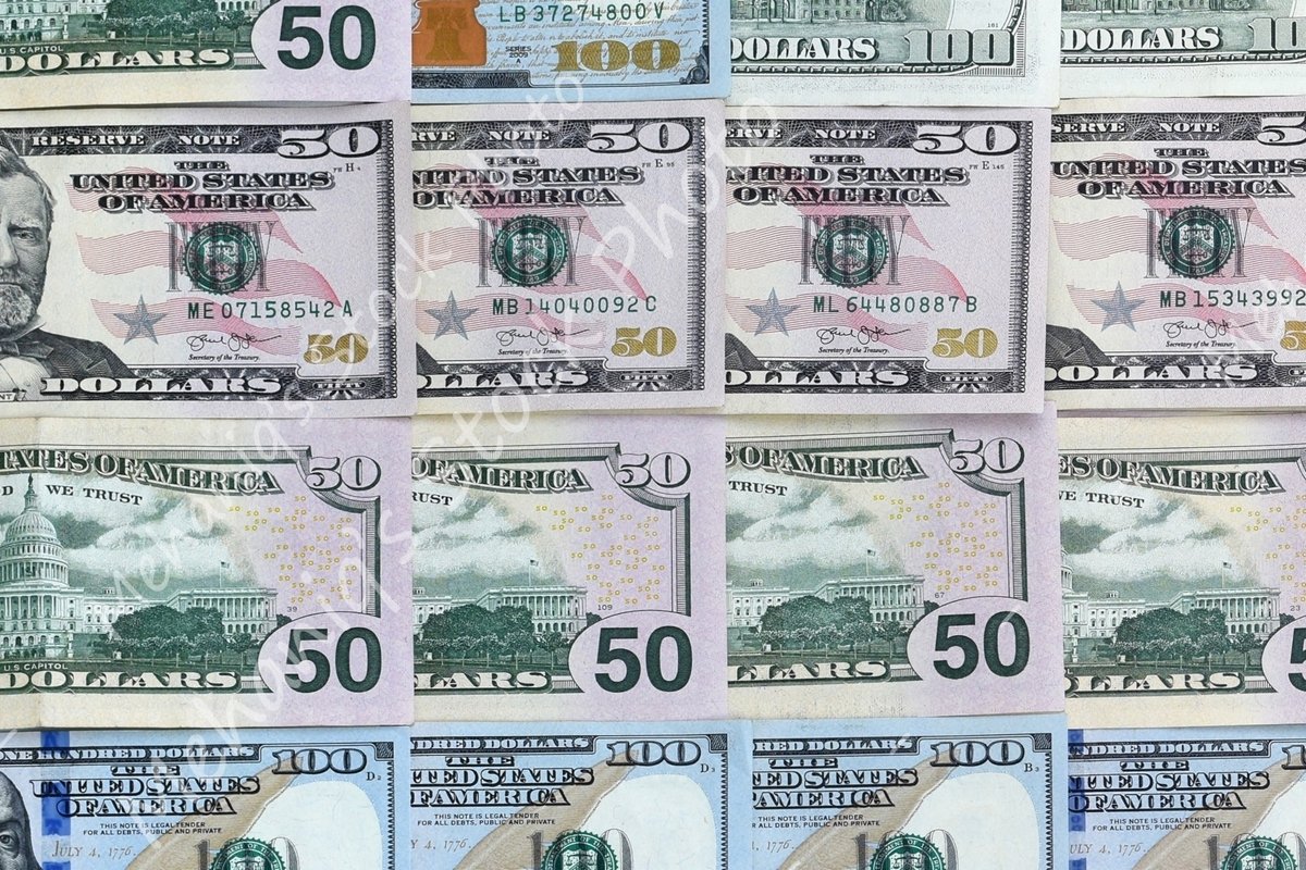 Many american dollar bills close up example image 1