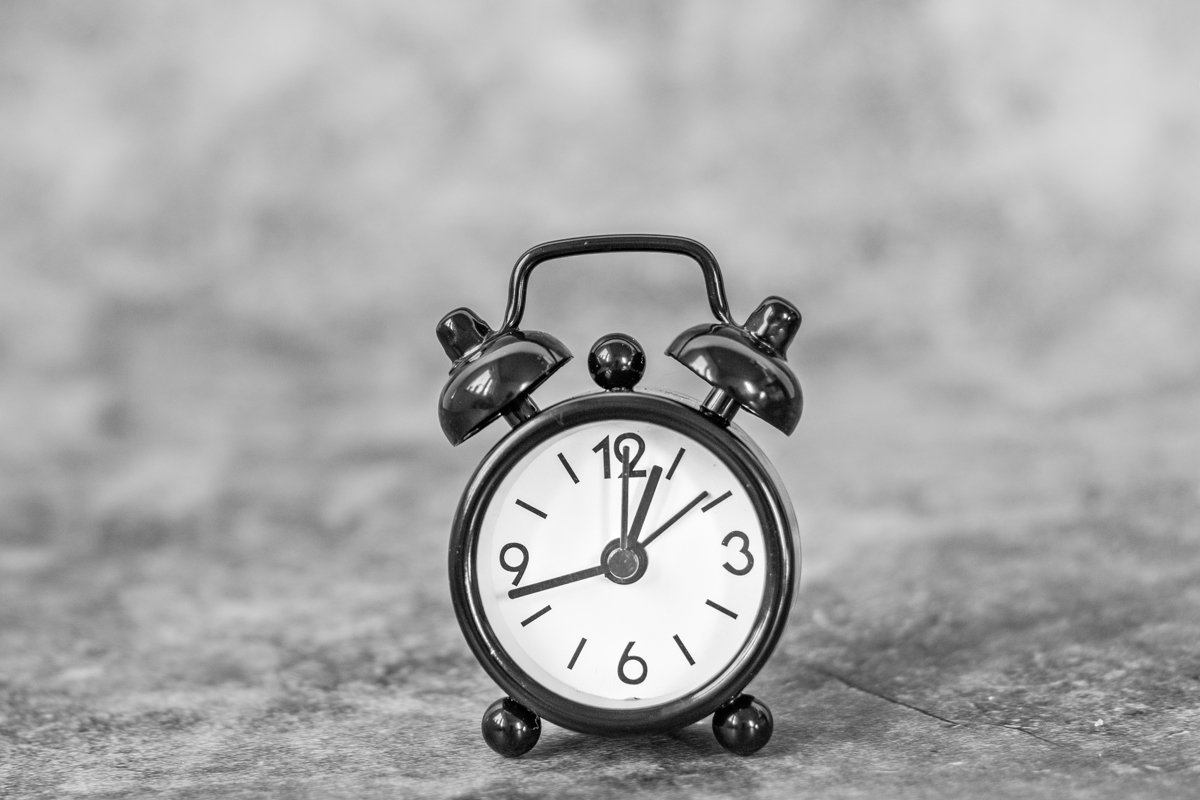 Black retro alarm clock on a vintage dark background example image 1