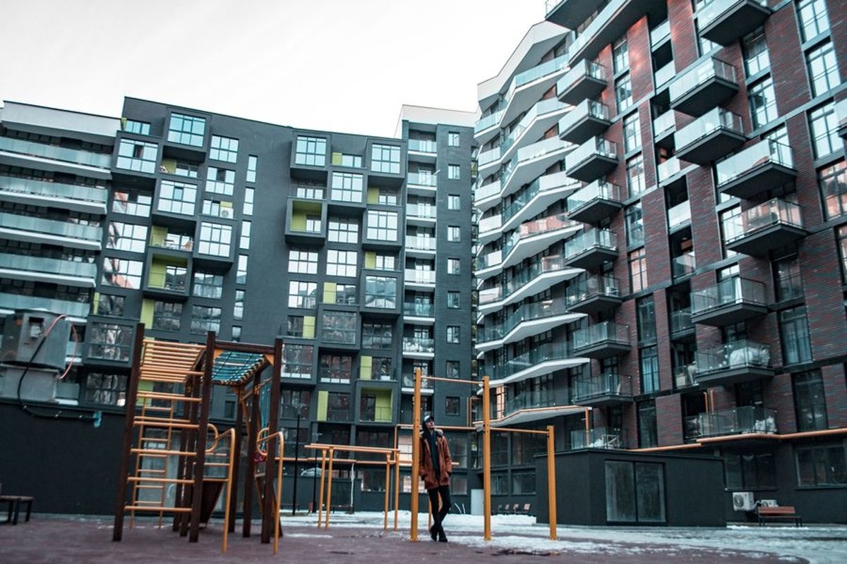 Young man walks in the city example image 1