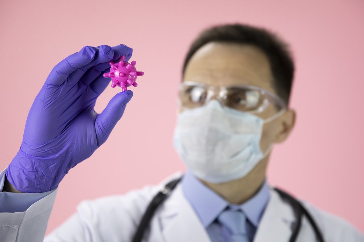 Doctor therapist with a stethoscope on a pink background example image 1